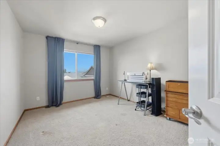 Third bedroom also facing south with views.