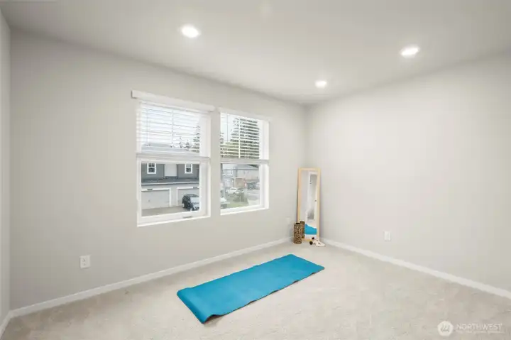 Spacious upstairs loft perfect for secondary living space, workout area, or office.