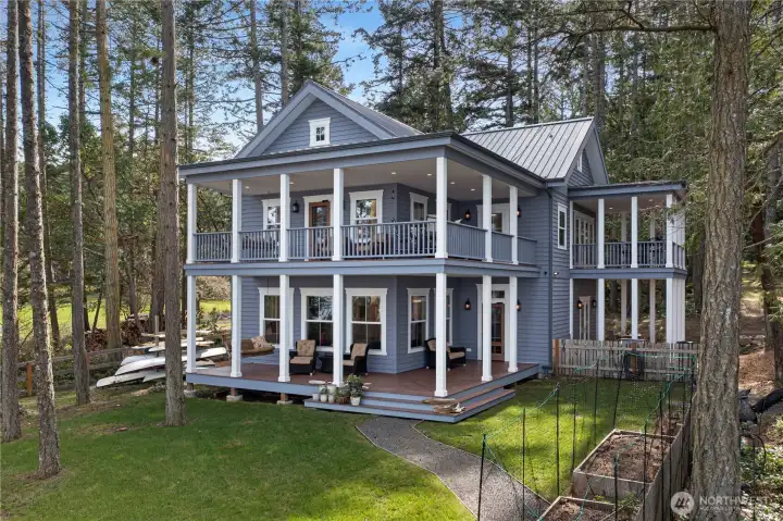 A custom estate on 2 parcels plus the original 1920's cottage!This area is fenced for your pets and people plus there are raised garden beds here. A custom estate on 2 parcels plus the original 1920's cottage!This area is fenced for your pets and people plus there are raised garden beds here.