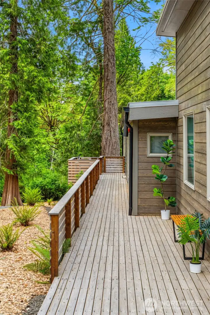 Welcoming front entry deck creates a seamless transition between the home and its natural surroundings. Welcoming front entry deck creates a seamless transition between the home and its natural surroundings.