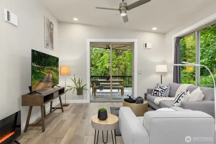 The main living level opens effortlessly to the outdoors, with forest views and natural light woven throughout the space. The main living level opens effortlessly to the outdoors, with forest views and natural light woven throughout the space.