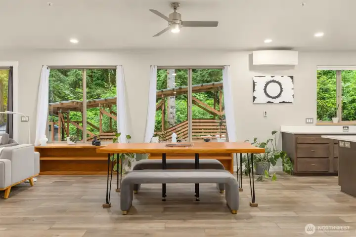 Expansive windows and warm contemporary finishes create a calm, light-filled gathering space immersed in nature. Expansive windows and warm contemporary finishes create a calm, light-filled gathering space immersed in nature.