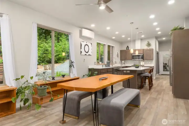 The main living area flows seamlessly into the kitchen and covered terrace, creating an effortless indoor-outdoor living experience. The main living area flows seamlessly into the kitchen and covered terrace, creating an effortless indoor-outdoor living experience.