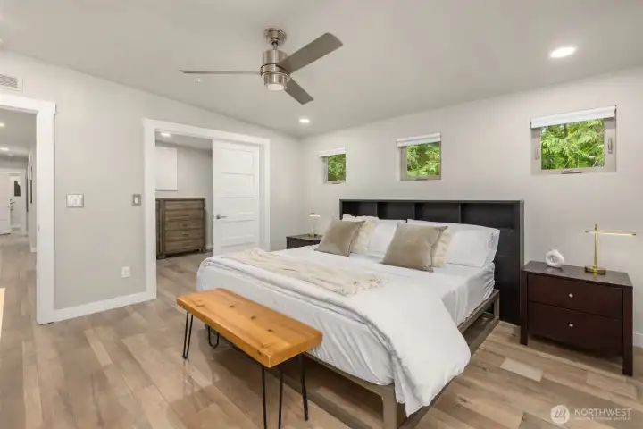 Designed with simplicity and comfort in mind, the primary suite offers airy proportions, soft contemporary finishes, and a quiet connection to the surrounding landscape. Designed with simplicity and comfort in mind, the primary suite offers airy proportions, soft contemporary finishes, and a quiet connection to the surrounding landscape.