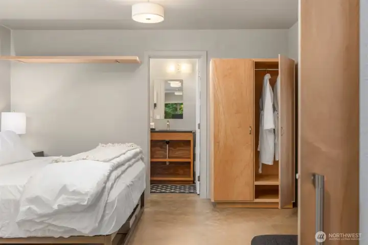 Designed as a comfortable guest retreat or independent living space, the ADU suite pairs a spacious bedroom with an adjacent modern bath and clean contemporary detailing. Designed as a comfortable guest retreat or independent living space, the ADU suite pairs a spacious bedroom with an adjacent modern bath and clean contemporary detailing.