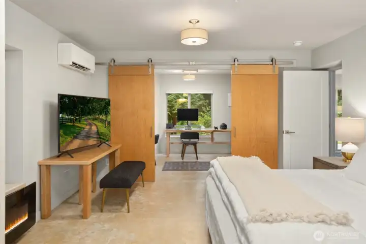 Sliding barn-style doors create a seamless connection between the ADU bedroom and dedicated study, offering flexibility for work, creative space, or extended stays. Sliding barn-style doors create a seamless connection between the ADU bedroom and dedicated study, offering flexibility for work, creative space, or extended stays.