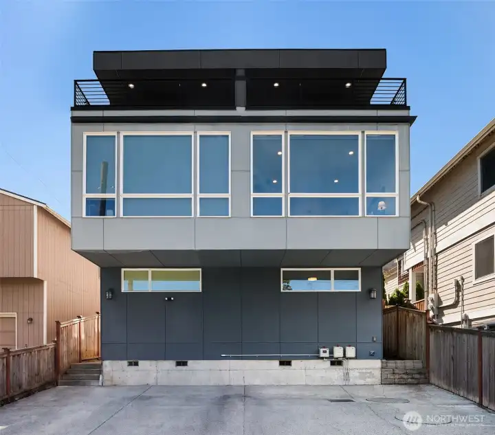 2019 modern Beacon Hill townhouse with cement-plank exterior, vertical siding, oversized windows, private entry, and off-street urban curb appeal.