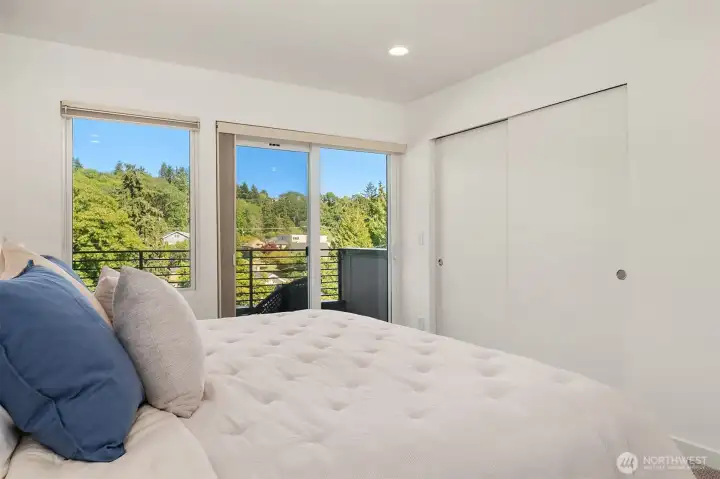 Primary suite comfortably fits king sized bed. Generous closet space. Triple pane windows for added peace and quiet.