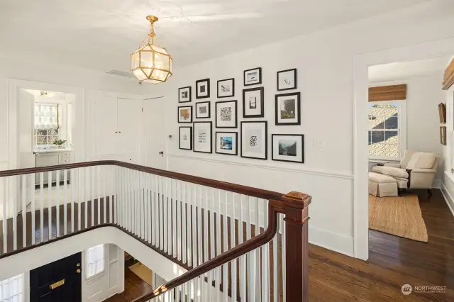 Upper level landing has curved balustrade, French doors to view deck to let in the sunlight and two linen storage closets.