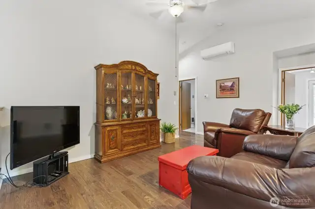 Living room off the kitchen with vaulted ceilings