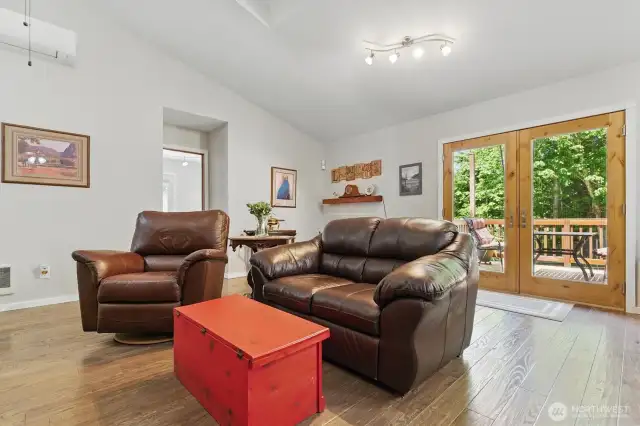Walk through the French doors off the kitchen to access the large deck
