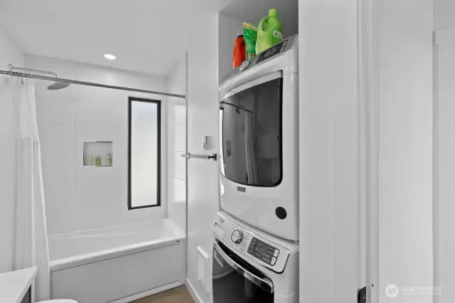 Main floor bathroom with washer and dryer
