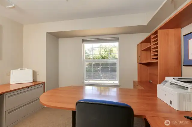 Large office with built in cabinets that all stay.