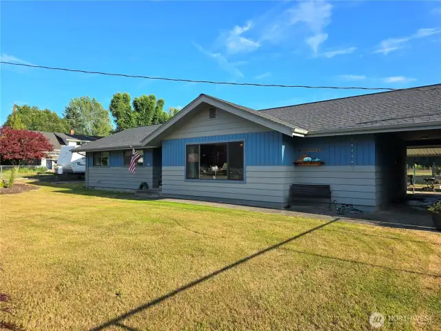 Walkway between home and garage leads you to your back yard.