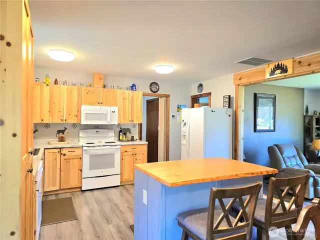 To hobby room, utility room & pantry & side entry leading to the 2-car garage.