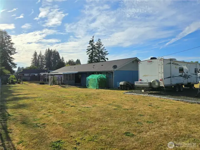 Gravel parking for all your toys. We know an RV and Boat fits. Check out the newer roof.
