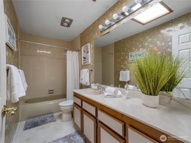 The second full bathroom is conveniently located in the middle of the unit.