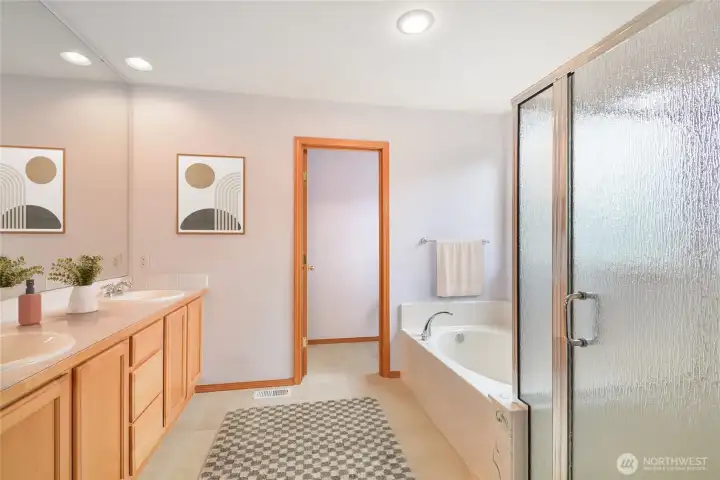 Primary bathroom is lovely with double sinks, and a separate tub and shower.