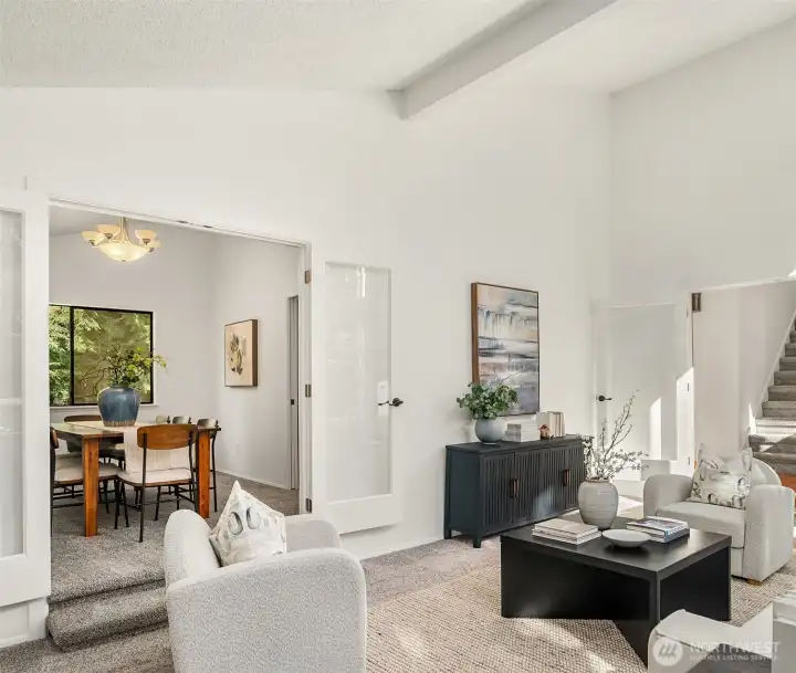 From the formal Living Room, enter into the dining room. French doors were added for additional privacy.