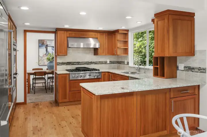 The cherry cabinets complement the neutral Quartz counters.