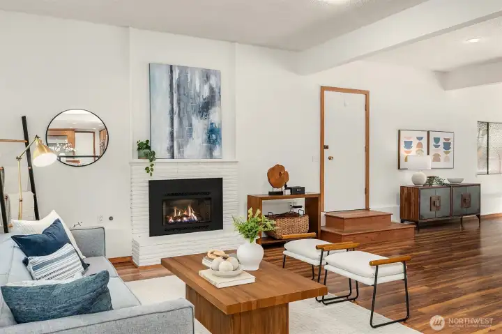 From the kitchen, step down to the Family room and expansive Rec room! Another gas fireplace makes for a cozy environment.