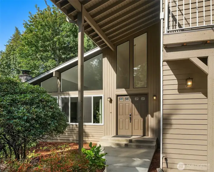 The covered front entry offers a wide approach and offers a friendly welcome to guests.