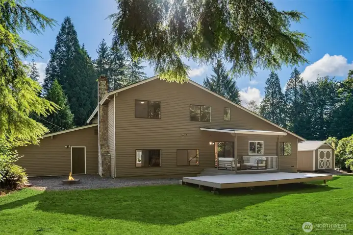 A backyard view of this stunning home. The grass has been alerted to be greener than it is today since photos were taken this Summer.