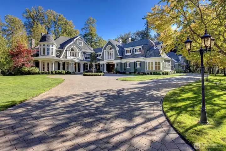 Gated front entrance leads to this 5+ acre estate. Notice the guest house int the back round