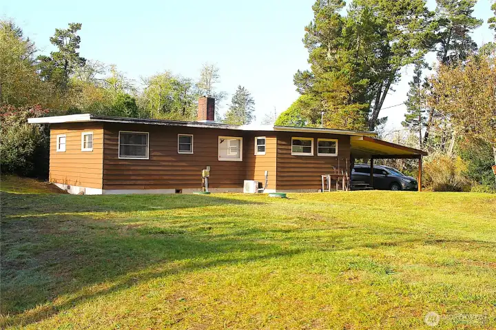 Rear view of the home with --