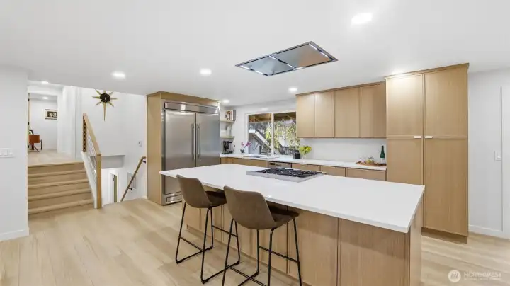 Clean, contemporary lines paired with warm wood cabinetry for a beautifully balanced kitchen.