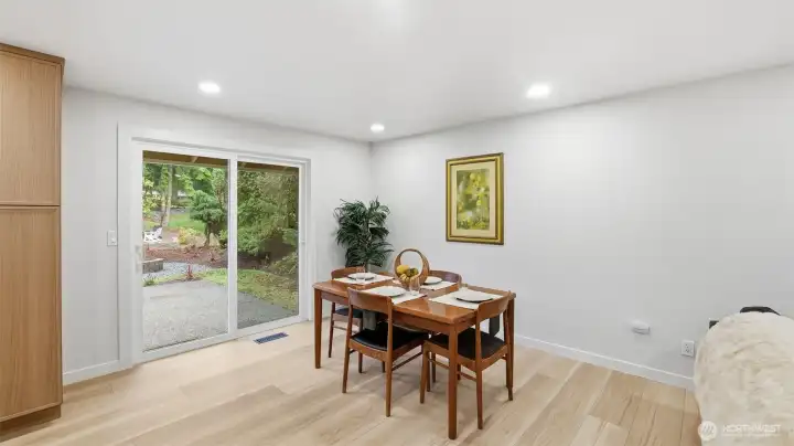 Charming dining area with slider access to the backyard for easy indoor–outdoor living.