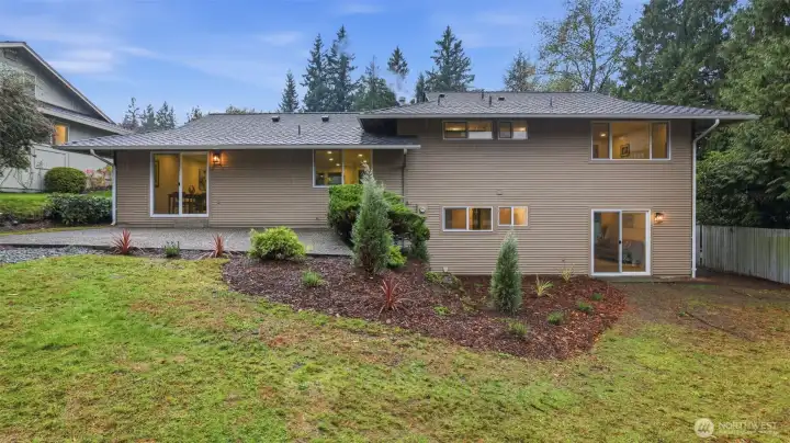 Thoughtful landscaping surrounds the spacious patio