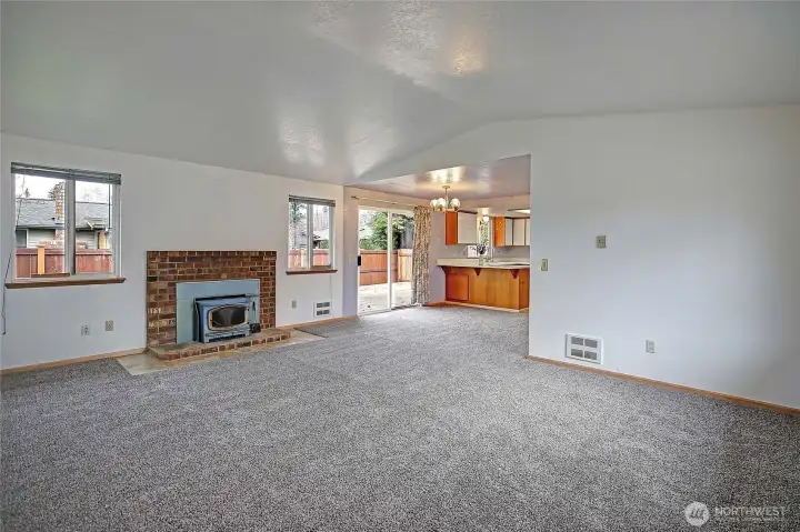 Inviting living room with a classic wood-burning fireplace