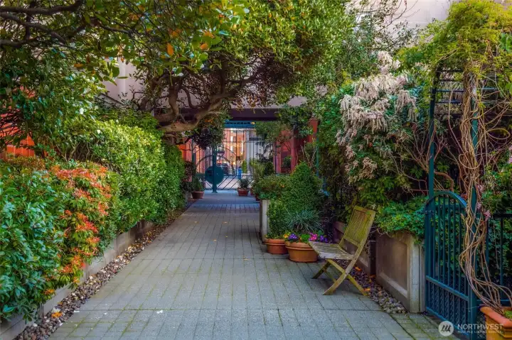 Take a stroll through the garden and courtyard, past the fountains, to the private gate leading to Post Alley