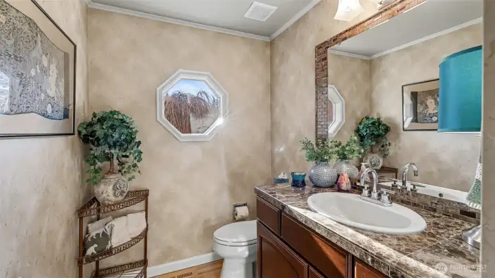 Conveniently located lower-level bath with stylish finishes.