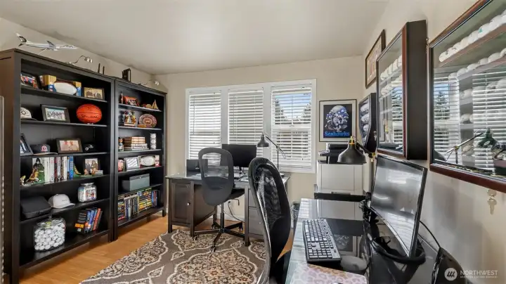 Upper-level guest room #1 with endless possibilities—perfect for guests, a home office, or whatever your lifestyle needs.