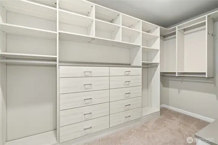 Primary suite walk-in closet with built-ins.