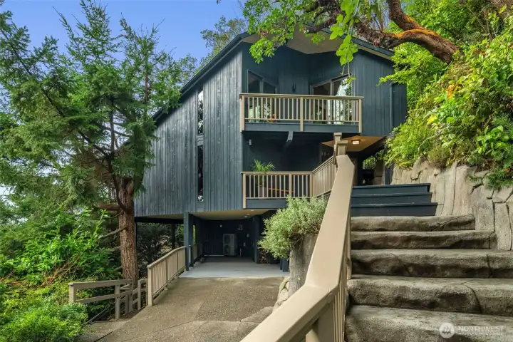 Enter the main floor via beautiful a stone stairwell