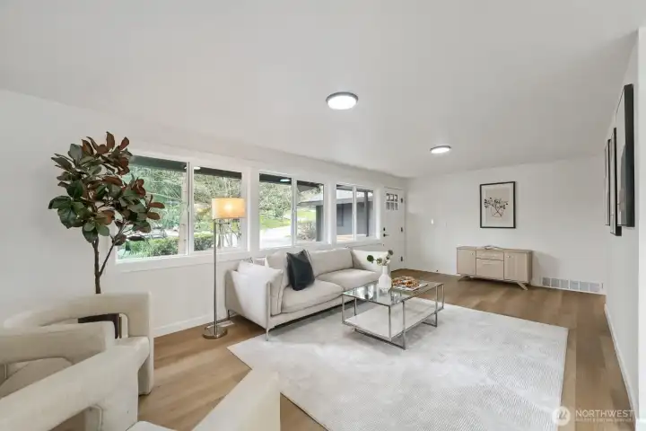 Light and bright floorplan with updated windows, luxury vinyl flooring throughout the main