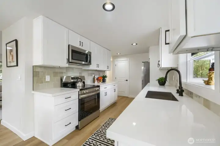 Beautiful Chef's kitchen with new cabinets, counters, and Stainless Appliances