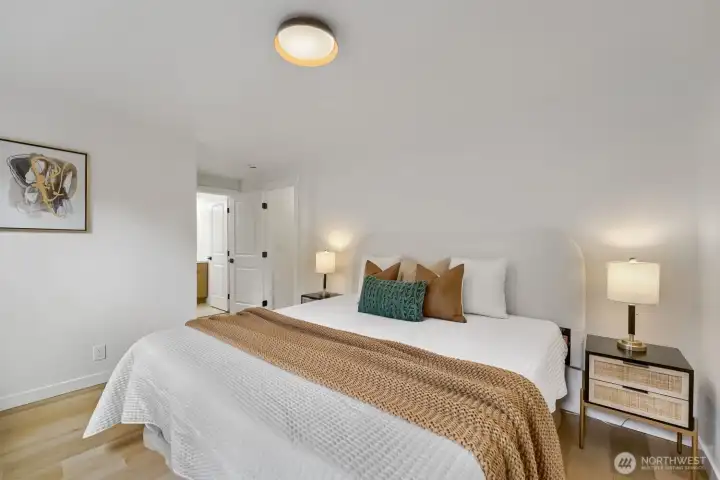Primary Bed enjoys walk-in closet and gorg updated .75 private bath