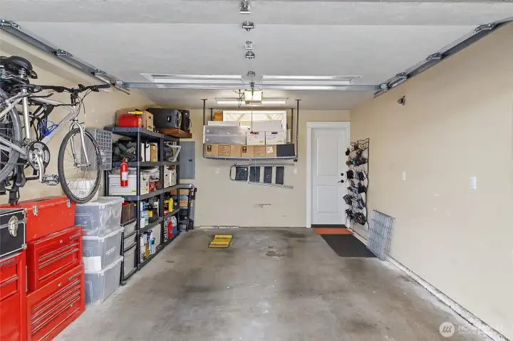 Generous garage with additional side storage room.