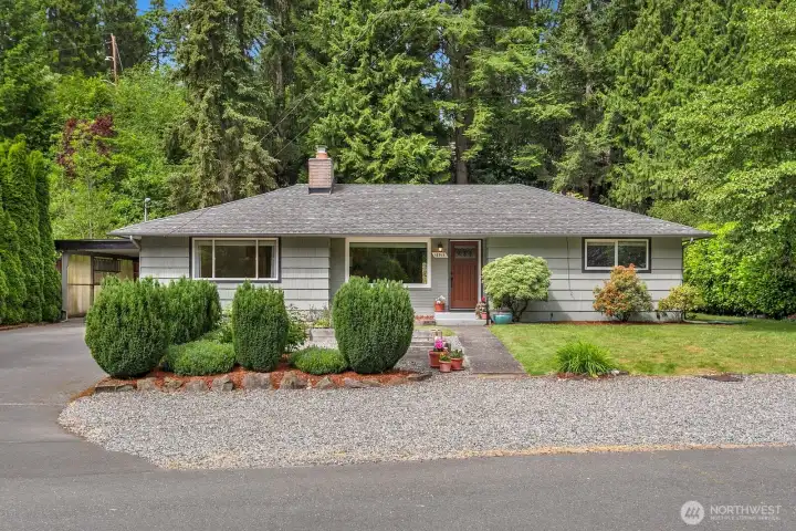 Park-like setting with beautifully maintained home and grounds.