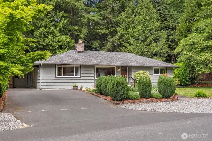 Covered parking area plus large driveway.