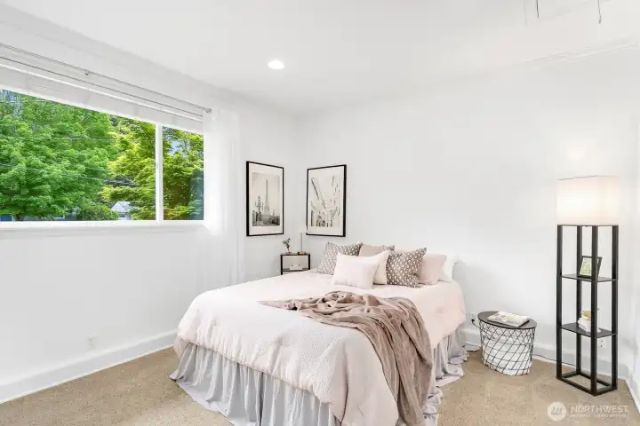 Step down the private hallway into the fourth bedroom/Guest room. Tall ceilings and lots of natural light lend to the grand feel of this space.