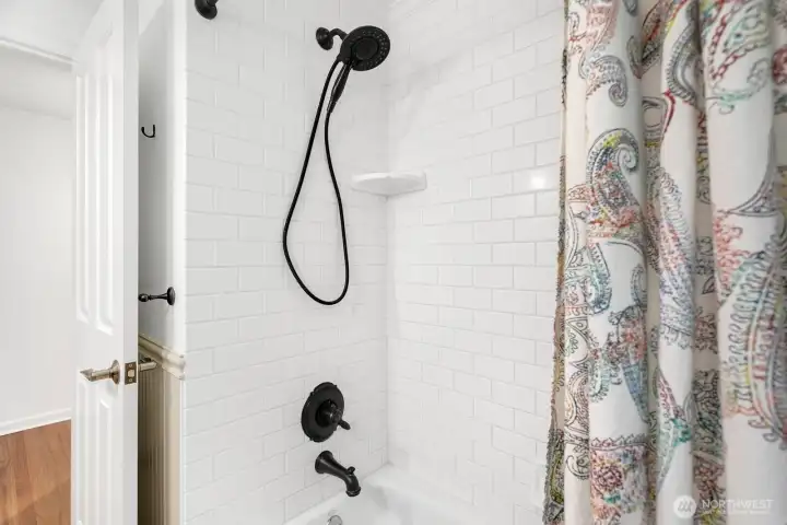 Fully tiled shower.