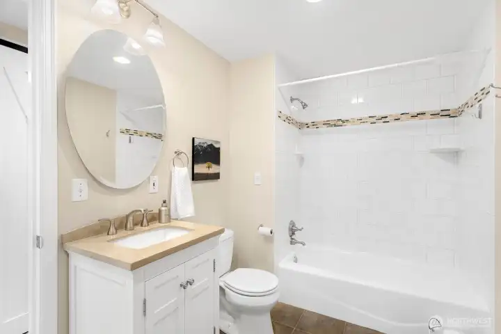Separate full bath near 4th bedroom/guest room offers the option for use as a suite.