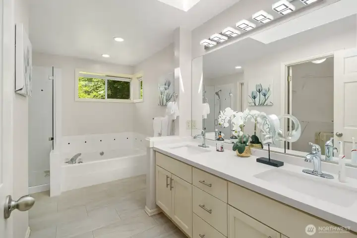 The luxurious 5-piece ensuite bath features a dual-sink vanity, soaking tub, and separate shower, delivering a spa-like experience that makes the primary suite feel like a true escape from the everyday.