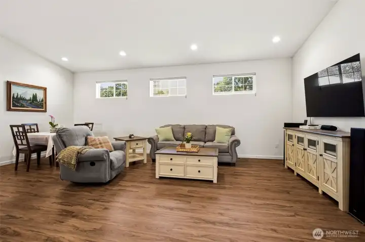 Large Living Room / Dining area with vaulted ceilings and remote operated blinds