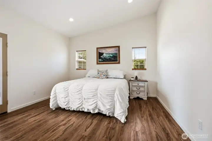 Primary Bedroom with vaulted ceilings and French doors to the  covered porch